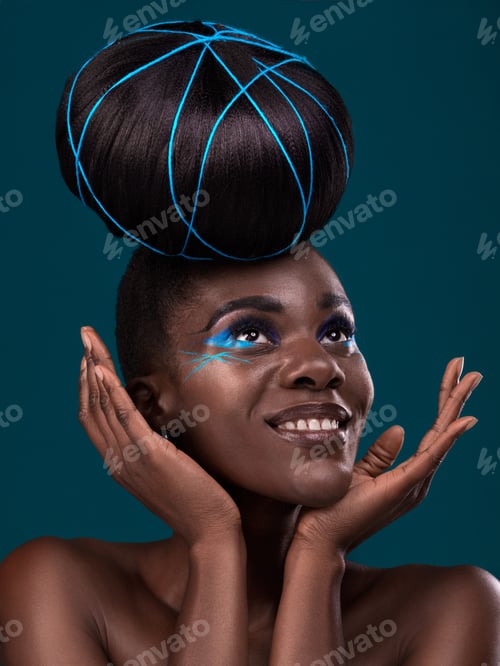 Preview: Studio shot of a beautiful young woman posing against a dark background