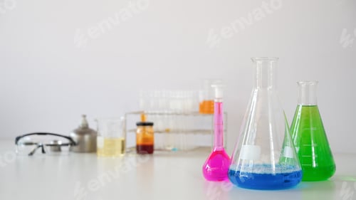 Preview: Photo of laboratory glassware containing colored liquids.