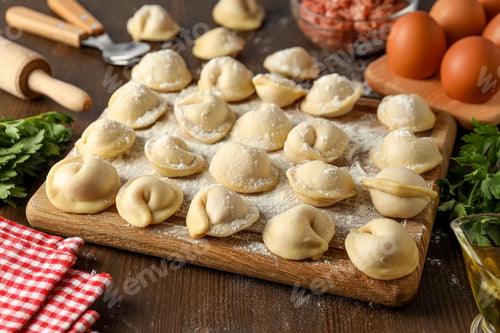 Preview: Cooking home food concept with raw dumplings
