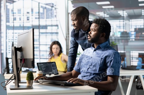 Preview: Teamworking colleagues solving tasks for team project at workplace