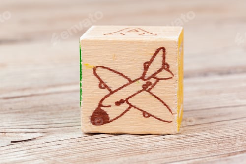 Preview: Multicolored wooden toy blocks on wooden background