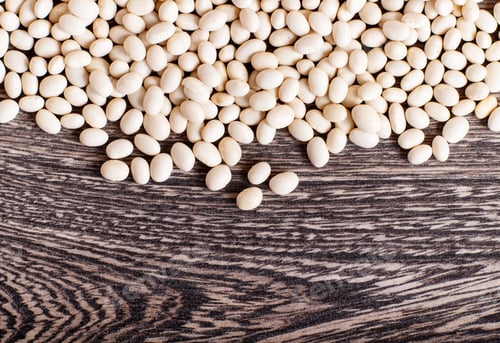 Preview: Texture of white beans isolated on a gray wooden background.