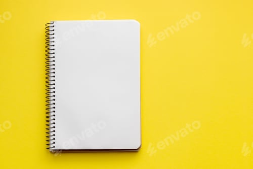Preview: Spiral notebook with blank empty white sheets on a bright yellow background