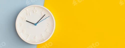 Preview: White wall Clock on color background. Back to school concept.