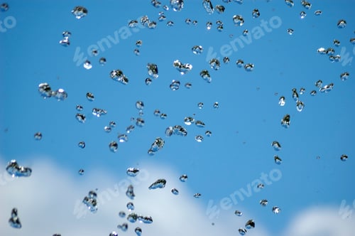 Preview: Blue water drops on blue sky background
