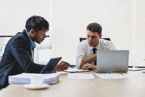 Preview: Business executives meeting to discuss planning the collaboration of people in the company.