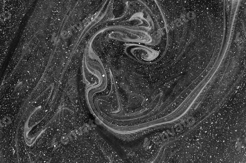 Preview: Abstract dark grey drawing with paints on the water. Ebru technique. Selective focus.