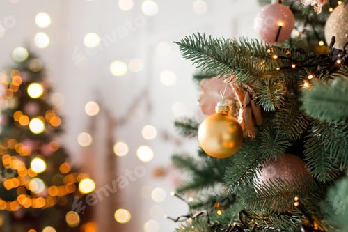 Preview: Christmas tree branches with decorations, balls, garlands, bokeh. Postcard with space for text.