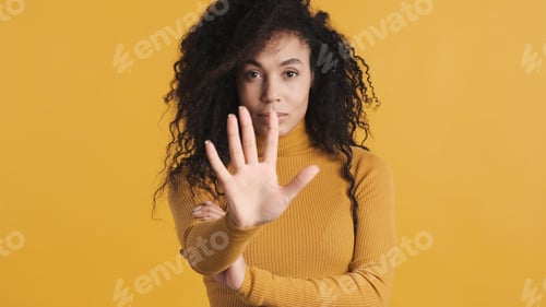 Preview: African American woman looking confident counting by fingers sho