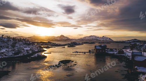 Preview: Aerial view from drone of small fishing bay with pier at golden sunset light