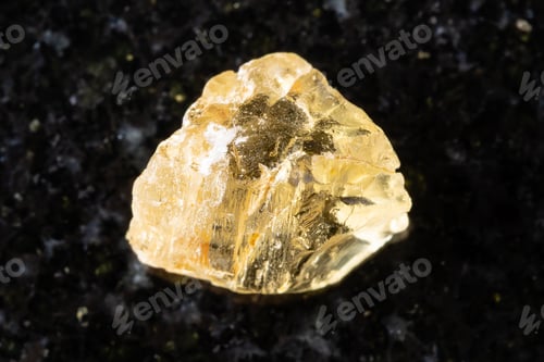 Preview: sample of rough yellow scapolite crystal on black