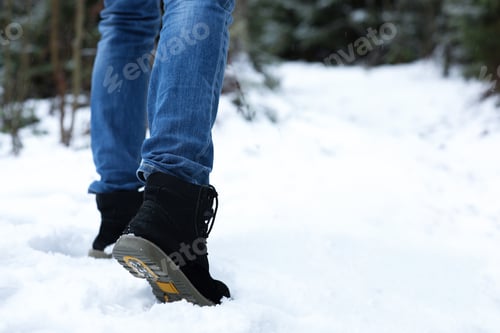 Preview: Woman walking outdoors on snowy day, closeup with space for text. Winter vacation
