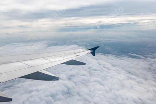 Preview: The plane was flying above the clouds