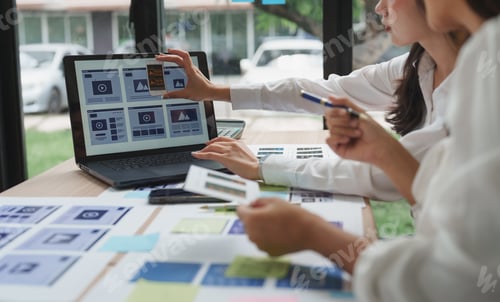 Preview: Web designers comparing mobile and desktop versions of website interface