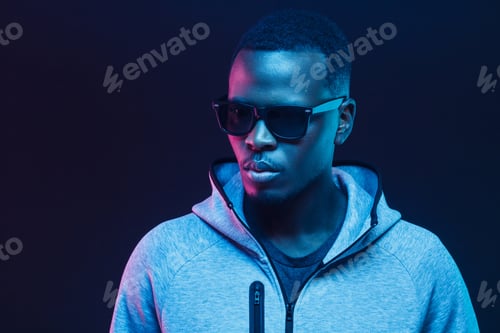 Preview: Portrait of handsome black man, wearing hoodie and sunglasses