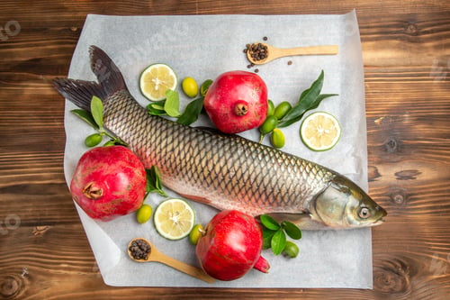 Preview: top view fresh fish with pomegranates on a wooden table food seafood dish ocean