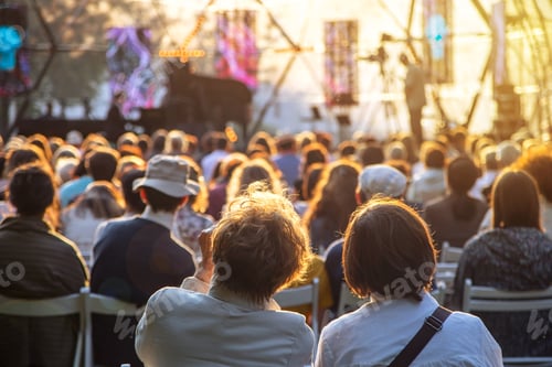 Preview: People watching concert on the outdoor scene. Sunny summer day.
