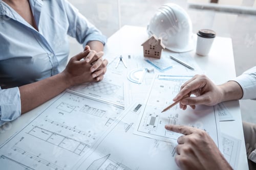 Preview: Team of engineering consulting and analyzing working on objects tools and construction drawings