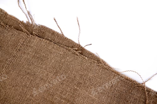 Preview: A Piece Of Old Burlap, Isolated On A White Background. Natural Sackcloth Textured For Background