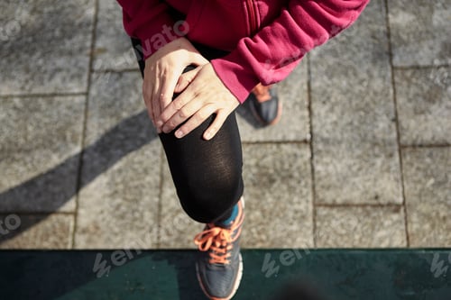 Preview: Overhead view of woman with leg raised stretching