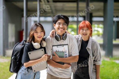 Preview: Three young people are standing together, smiling and holding backpacks