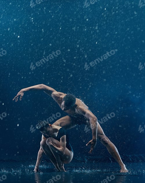 Preview: Young couple of ballet dancers dancing unde rwater drops