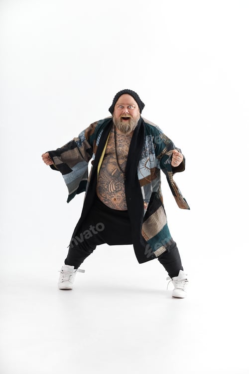 Preview: Fat stylish bearded tattoed caucasian man with big belly is posing and dancing wearing ethnic kimono