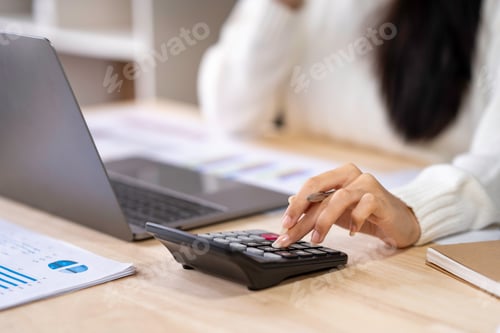 Preview: financial business woman calculating corporate income tax data and analyze financial stock charts th