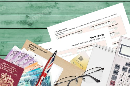 Preview: English Tax form sa105 UK Property from HM revenue and customs lies on table with office items