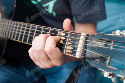 Preview: The guy plays the acoustic guitar. Strings close up