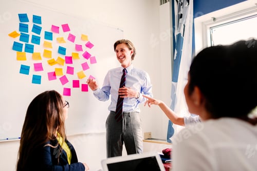 Preview: Business people with sticky notes on whiteboard