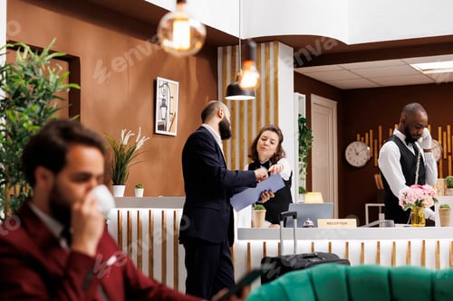 Preview: Businessman reviews registration files