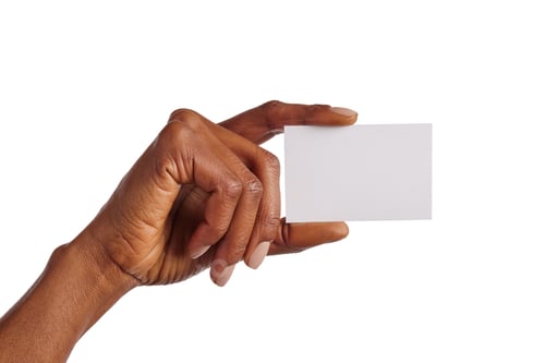 Preview: African american woman hand holding blank business card isolated
