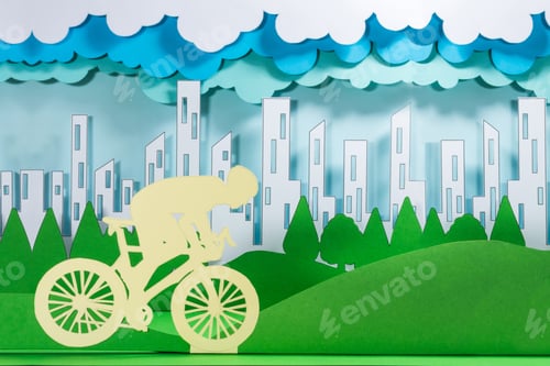 Preview: Figurines of a person on a bicycle with buildings and trees