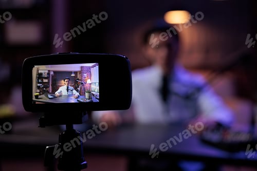 Preview: Asian vlogger filming video on camera