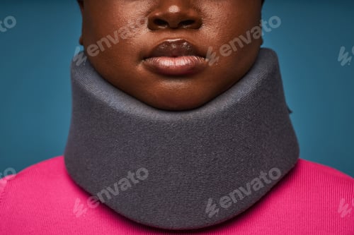 Preview: Unrecognizable black woman wearing neck brace