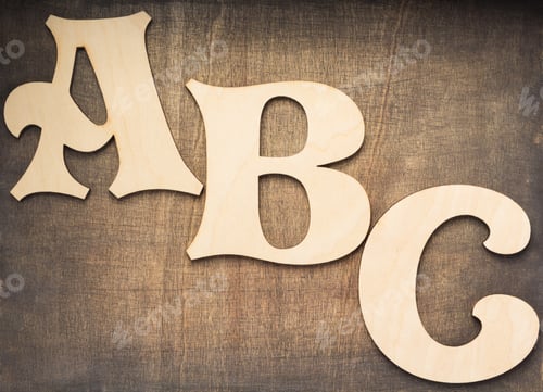 Preview: wooden letters at plywood background