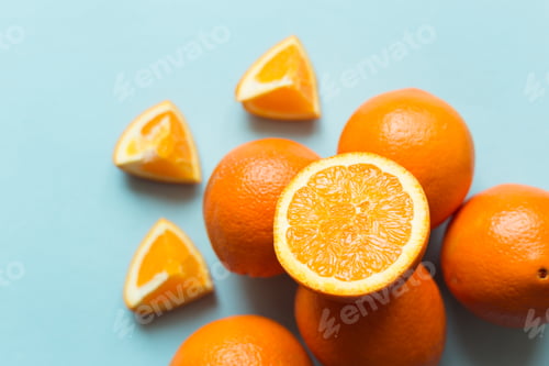Preview: Fresh oranges on the blue background