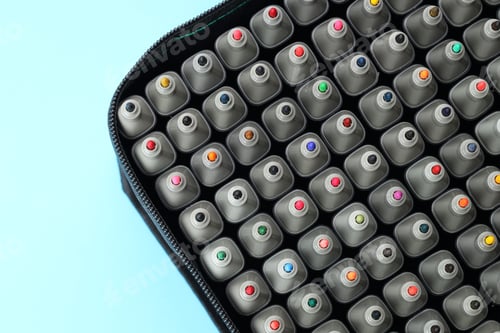 Preview: Many colorful markers in bag on light blue background, top view. Space for text
