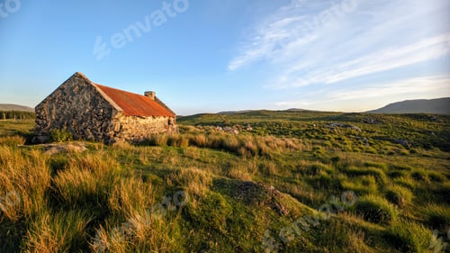 Preview: Beautiful landscape scenery with old rusty tin roof cottage on green hill at Connemara National par