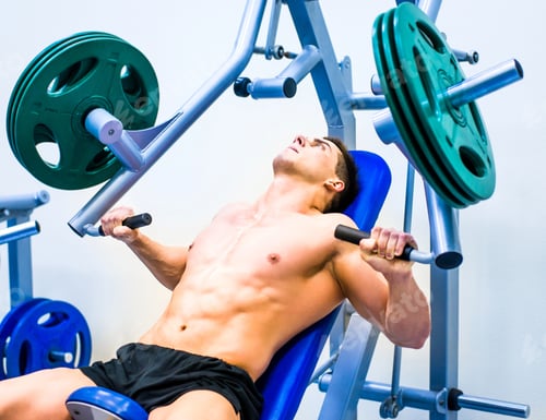 Adult Man Working Out on Weight Machine