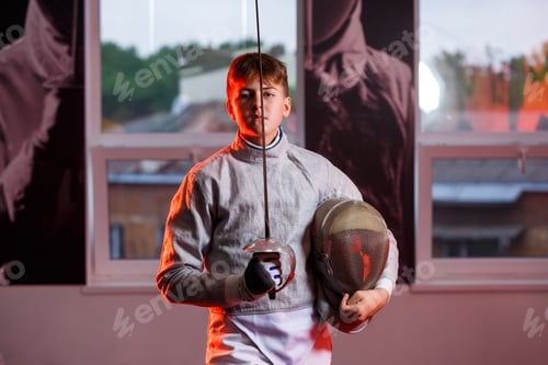 Preview: A guy in a fencing suit with a sword in his hand, neon light. A young model trains and trains