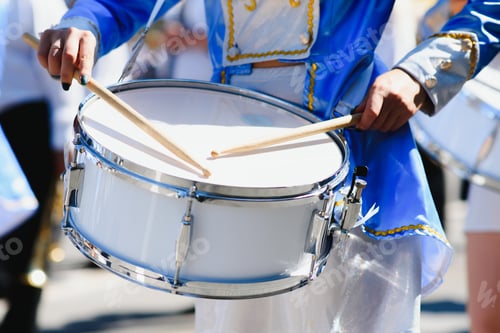 Preview: majorettes with white and blue uniforms perform in the streets of the city. photographic series