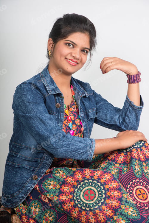 Preview: Portrait of beautiful smiling asian woman sitting on a chair