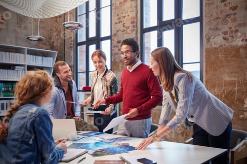 Preview: Colleagues brainstorming at a meeting in creative office
