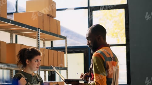 Preview: Warehouse team reviewing goods in packs
