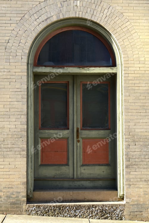 Preview: An interesting old door in an arched doorway.