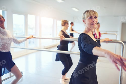 Preview: Group of fit women doing gymnastics in class