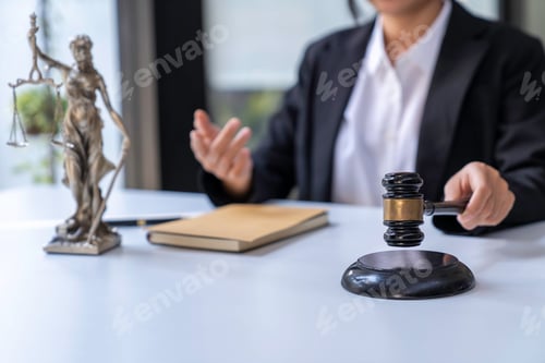 Preview: A judge takes a hammer with a lawyer for justice. A businesswoman in a suit or a lawyer works on doc