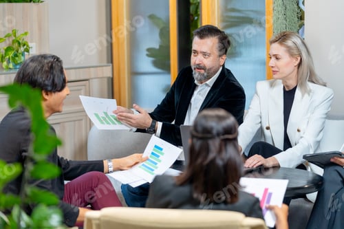 Preview: Asian business man discuss with Caucasian manager about the project in coworking space of company